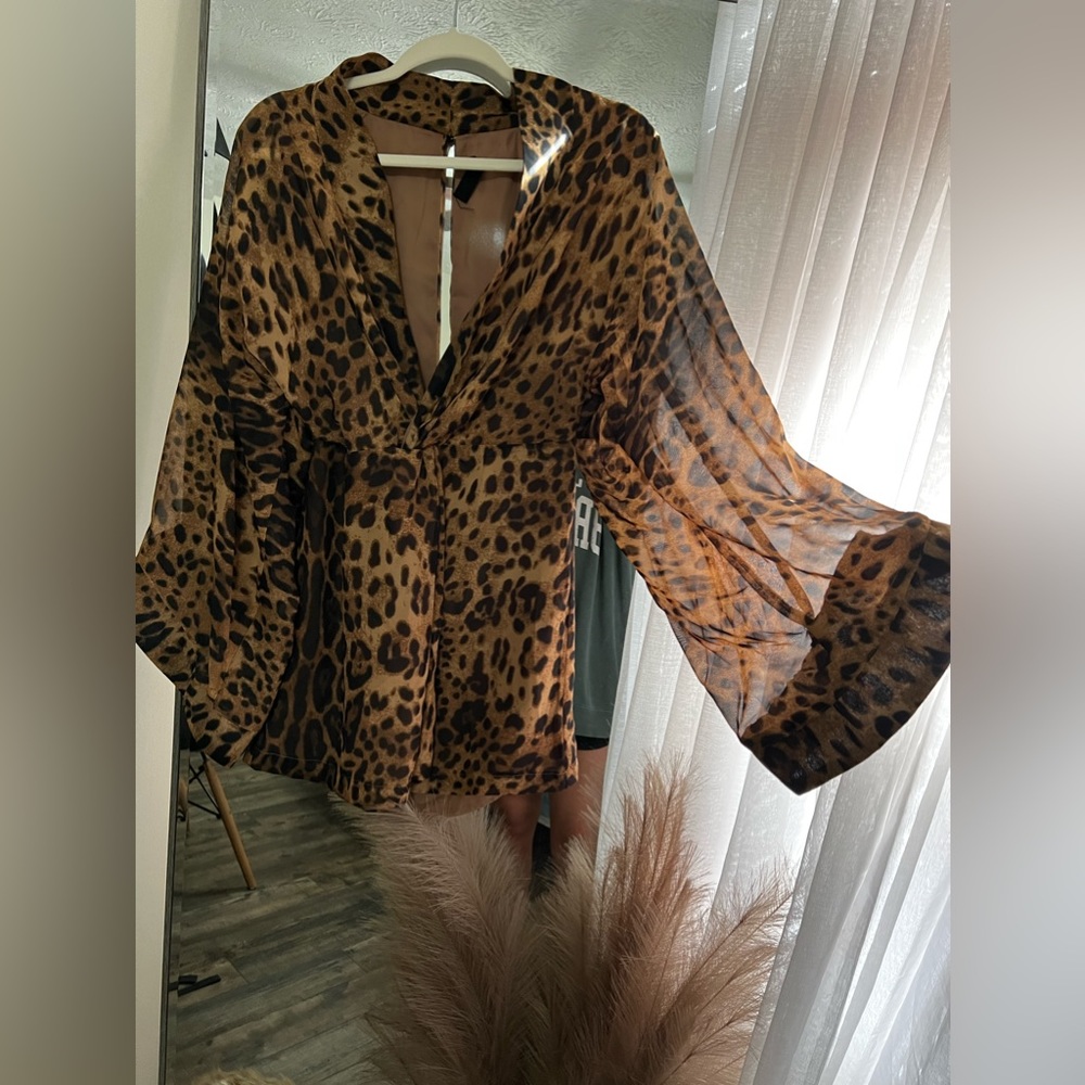 Leopard print boutique dress. Size M. It is on the shorter side. - Picture 1 of 3